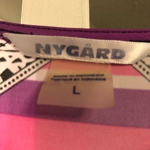 Like new top. Brand is Peter Nygard. The top is very pretty and colorful.